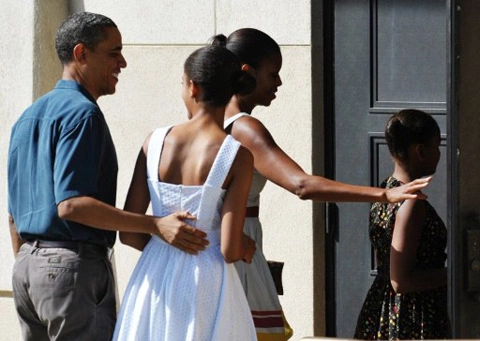 From left: US President Barack Obama, daughter Malia, First Lady Michelle Obama, and daughter Sasha make their way into the chapel for Christmas service at Marine Corps Base Hawaii December 25, 2011. From left: US President Barack Obama, daughter Malia, First Lady Michelle Obama, and daughter Sasha make their way into the chapel for Christmas service at Marine Corps Base Hawaii December 25, 2011.