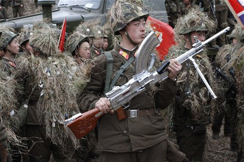 n this Sunday March 4, 2012 photo, North Korean soldiers, including one carrying a weapon that military personnel say was given to them by North Korean leader Kim Jong Un, gather at a military base on North Korea's southwest coast, opposite South Korea's Baengnyeong Island. (AP Photo/Kim Kwang Hyon) n this Sunday March 4, 2012 photo, North Korean soldiers, including one carrying a weapon that military personnel say was given to them by North Korean leader Kim Jong Un, gather at a military base on North Korea's southwest coast, opposite South Korea's Baengnyeong Island. (AP Photo/Kim Kwang Hyon)
