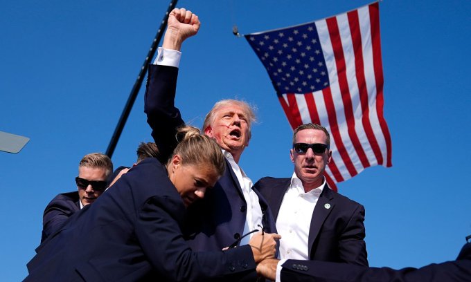 Republican presidential candidate former President Donald Trump reacts as he is surrounded by U.S. Secret Service agents at a campaign rally, Saturday, July 13, 2024, in Butler, Pa. Photo by AP