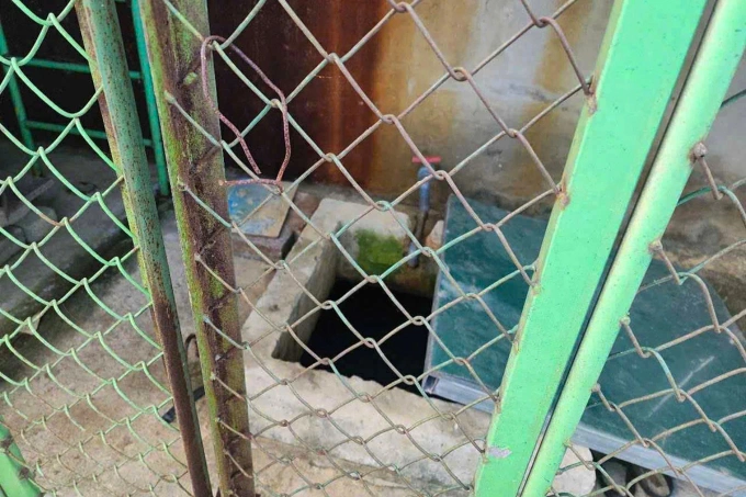 Bể chứa nước nơi phát hiện thi thể bé trai 5 tuổi. Ảnh: Hùng Lê