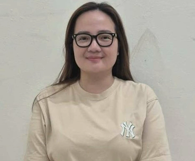 Doanh nhân Hoàng Hường tại cơ quan điều tra. Ảnh: Bộ Công an