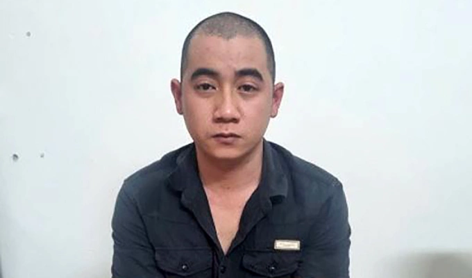 Đặng Văn Sang tại cơ quan công an. Ảnh: Ngọc Oanh