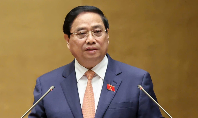 Thủ tướng Phạm Minh Chính báo cáo trước Quốc hội sáng 20/10. Ảnh: Hoàng Phong