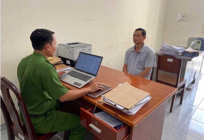 Nghi can làm việc tại Cơ quan cảnh sát điều tra. Ảnh: Thái Hà