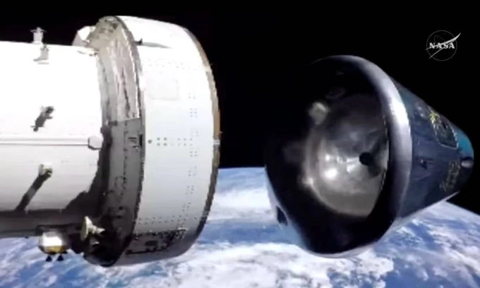 Mô phỏng khoang chở người và khoang dịch vụ của tàu Orion chia tách phía trên khí quyển Trái Đất. Ảnh: NASA