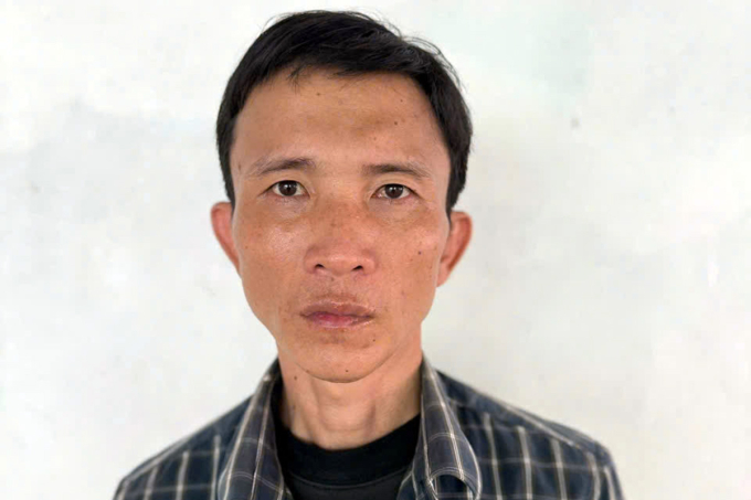 Ân khi bị công an bắt giữ. Ảnh: Thành Huynh
