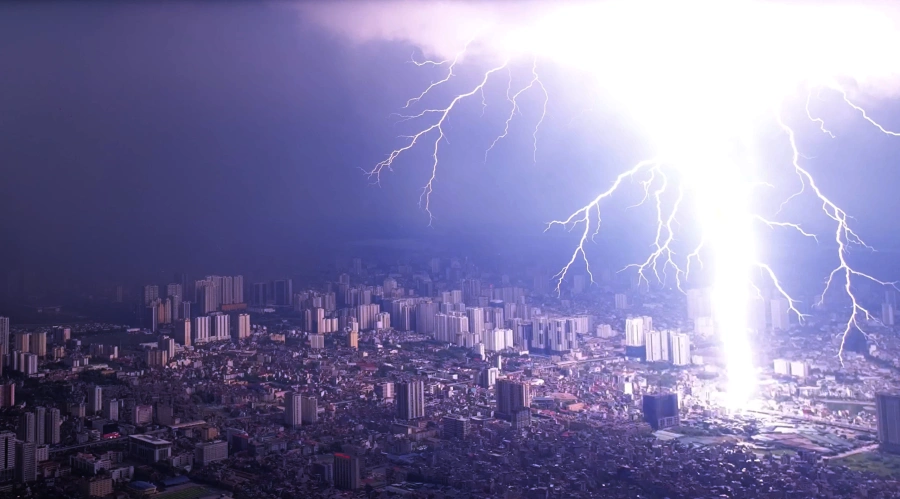 Lightning strikes Hanoi as storm floods streets at rush hour