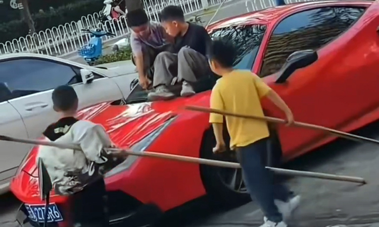 Four boys use $530,000 Ferrari as slide in China, parents offer only $735 to fix scratches