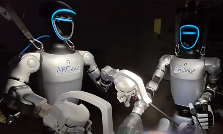 The surgery uses two remote-controlled humanoid robots. Photo: UCSD