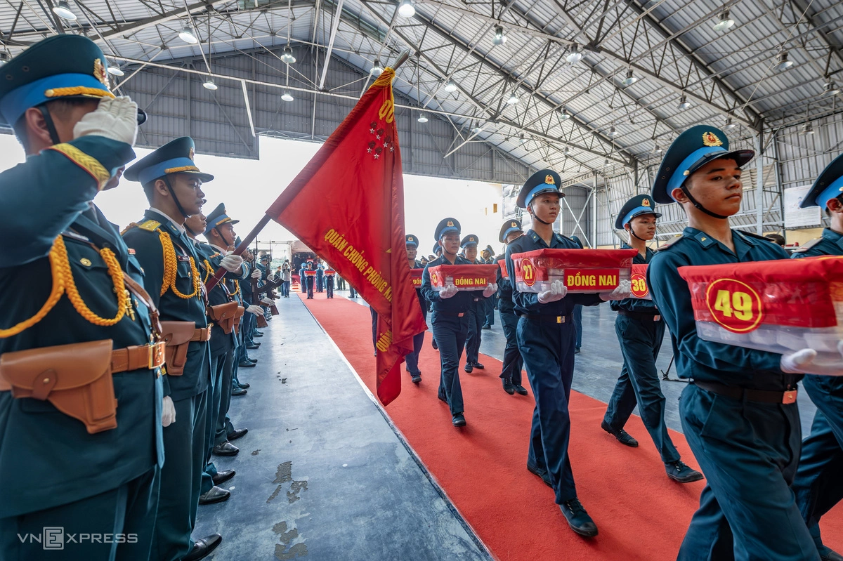 Vietnam transports remains to identify fallen soldiers